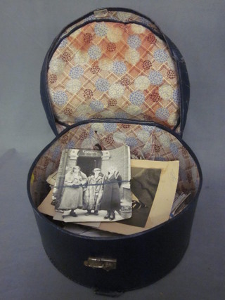 A blue fibre hat box containing a collection of postcards