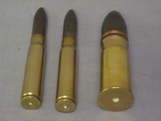 A Continental brass shell 6" and 2 canon shells
