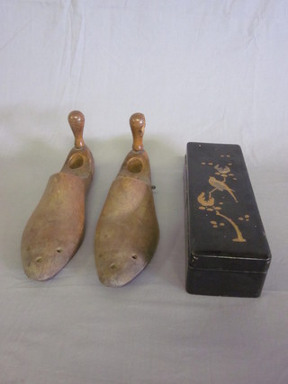 A rectangular black lacquered glove box with hinged lid  decorated a bird and a pair of shoe trees