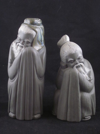 A pair of matt finished Lladro figure of standing Oriental Sages 8" and 7"