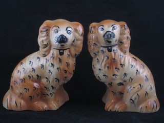A pair of Staffordshire figures of seated brown Spaniels 6"