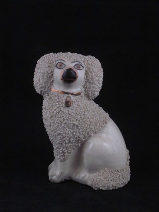 A Staffordshire figure of a seated Spaniel 5"