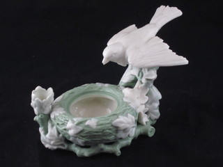 A 19th Century Minton porcelain vase in the form of a bird in  birds nest, 7"