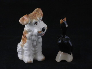 A Mid Winter pie lifter in the form of a blackbird 3" and a Sylvac figure of a seated dog 3"