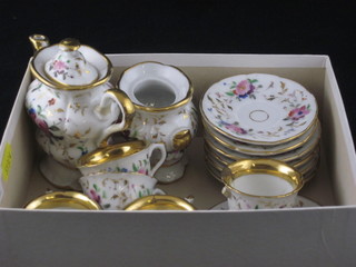 A Victorian 15 piece childs porcelain coffee service with coffee  pot - restored, twin handled sucrier, 2 plates 3", 5 cups - 3  damaged and 6 saucers - 2 chipped