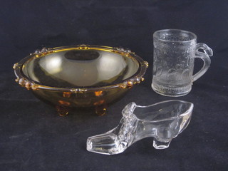 2 circular amber glass dishes by Saubi, raised on bun feet 8", together with a pressed glass tankard 4" and a model of a ladies  shoe 4"