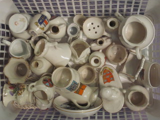 A plastic crate containing a collection of crested china