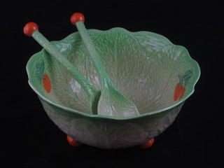A circular Beswick leaf shaped salad bowl raised on circular bun  feet with gilt mark to the base complete with salad servers 9"