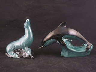 3 Poole Pottery blue glazed graduated figures of dolphins 6" -  11" and a do. figure of a sea lion 4"