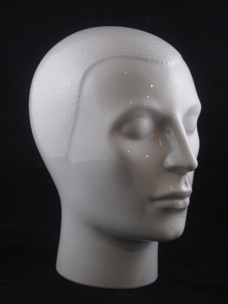 A white glazed pottery figure in the form of a human's head 10"