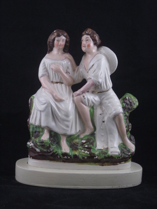 A pair of 19th Century Staffordshire figures of seated couples,  9", both f,