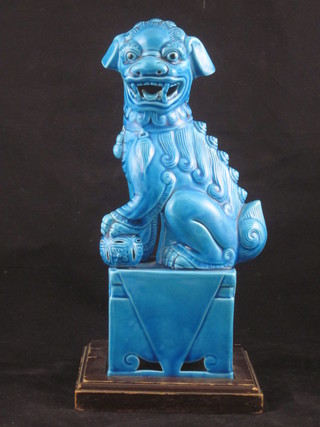 A blue glazed figure of a seated Dog of Fo 10"