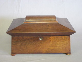 A Victorian rosewood twin compartment tea caddy of  sarcophagus form with hinged lid, raised on bun feet 13", escutcheon missing,