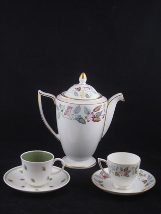 A 15 piece Minton Cherry Down pattern coffee service  comprising coffee pot, cream jug, sugar bowl, 6 coffee cups and  6 saucers, together with a 10 piece Susie Cooper Whispering  Grass coffee service comprising 6 saucers and 4 coffee cups