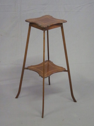An Edwardian square mahogany 2 tier jardiniere stand, raised on  outswept supports 9"