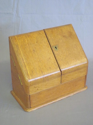A Victorian bleached oak stationery box enclosed by a pair of  panel doors 11 1/2"