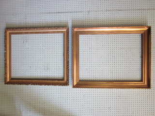 2 gilt picture frames 25" x 19" and 23" x 19"
