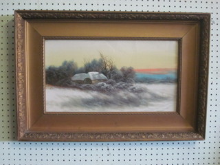 A 19th Century oil on board "Snowy Scene of a Thatched  Cottage at Dusk" 9" x 17" contained in a gilt frame