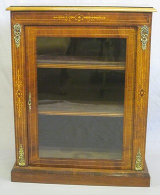 A Victorian inlaid mahogany Pier cabinet with brass  mounts, the shelved interior enclosed by glazed panelled doors,  29"