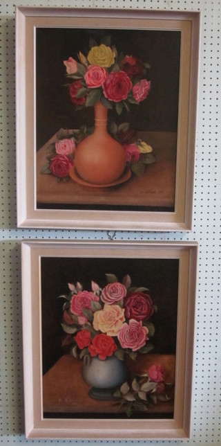 W Askham, a pair of oil on canvases, still life studies "Vases of Roses" signed and dated 1917, 19" x 15"