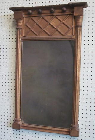 A Regency rectangular plate chimney mirror contained in a gilt frame with column decoration to the side 15"