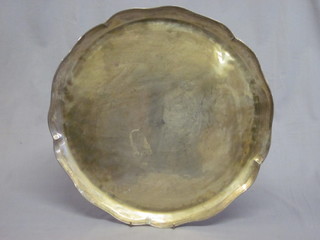 An oval white metal tray with shaped borders 16"