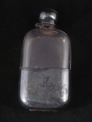 A glass hip flask with detachable silver plated cup