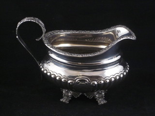 A Victorian silver cream jug with demi-reeded decoration,  Sheffield 1896 11 ozs