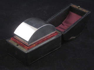 A 19th Century French rectangular tea caddy with arch shaped  hinged lid, 5 ozs, contained in a leather case