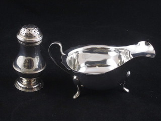 A Georgian silver pepperette London 1786 together with a silver sauce boat with wavy border, Sheffield 1959, 5 ozs