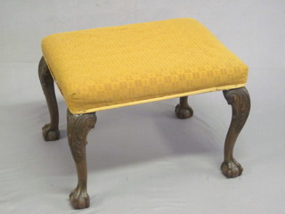 A 19th Century rectangular Chippendale style mahogany stool, raised on cabriole ball and claw supports 25"