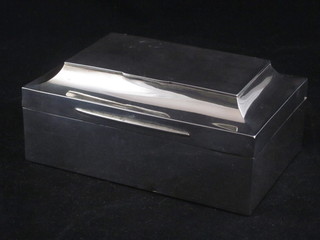 An Edwardian rectangular silver cigarette box the shaped hinged  lid fitted a match box 5", London 1903