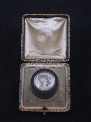 A 19th Century circular tortoiseshell rouge pot, the lid painted a portrait miniature of a bonnetted lady, 1" contained in a leather  presentation box