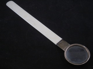 A silver and ivory mounted letter opener, the top fitted a magnifying glass