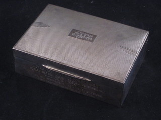 A silver cigarette box with hinged lid and engine turned decoration Birmingham 1935, 5"