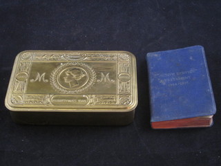 A Princess Mary gift tin containing a 1914-15 Active Service testament and a Christmas card