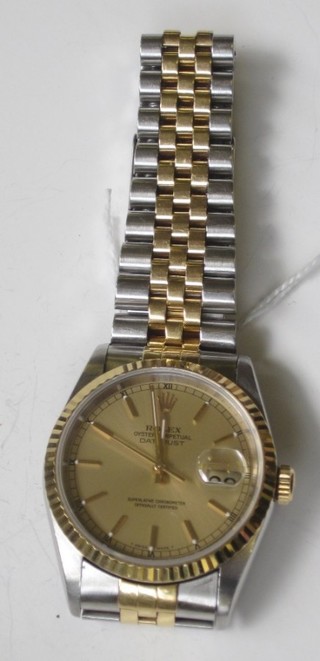 A gentleman's Rolex Oyster Perpetual Day/Date just wristwatch,  contained in a bi-metal case and with bi-metal strap, boxed and  with some paperwork,  ILLUSTRATED