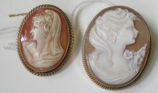 2 shell carved cameo portrait brooches contained in gold mounts