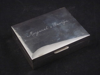 A silver cigarette box with hinged lid 4"