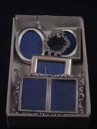 A modern silver oval easel photograph frame 2 1/2", a square  ditto 2" and 3 other small photograph frames