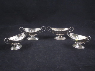 A matched set of 4 silver boat shaped twin handled salts Birmingham 1901 and Chester 1900, 3 ozs