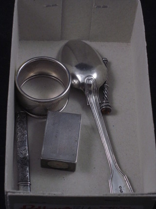 A silver fiddle pattern pudding spoon, a silver match slip, napkin ring, paper knife and propelling pencil