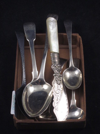 A Georgian silver pudding spoons, London 1807, 3 Georgian  silver teaspoons, 2 mustard spoons and a silver bladed butter  knife, 3 ozs