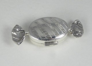 A modern silver trinket box in the form of a sweet