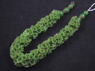 A Venetian green glass and floral patterned necklace