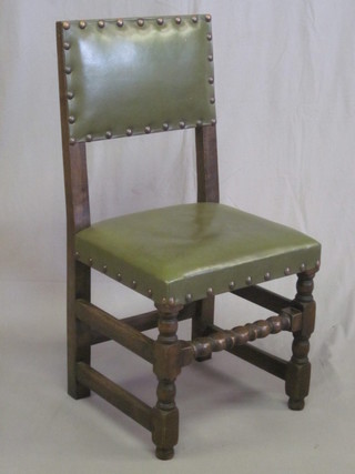 A set of 6 oak dining chairs with upholstered green leatherette  seats and backs, formerly from the Whitbread sale