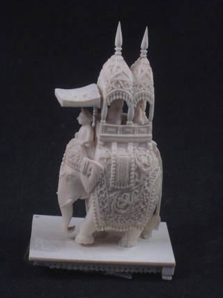 A carved ivory figure of a walking elephant 5"