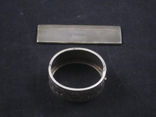 A silver cased comb and a Sterling silver bracelet