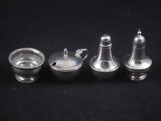 A silver mustard and pepper pot Sheffield 1925 and a silver mustard and salt pot