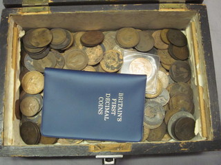 A box containing a collection of copper coins